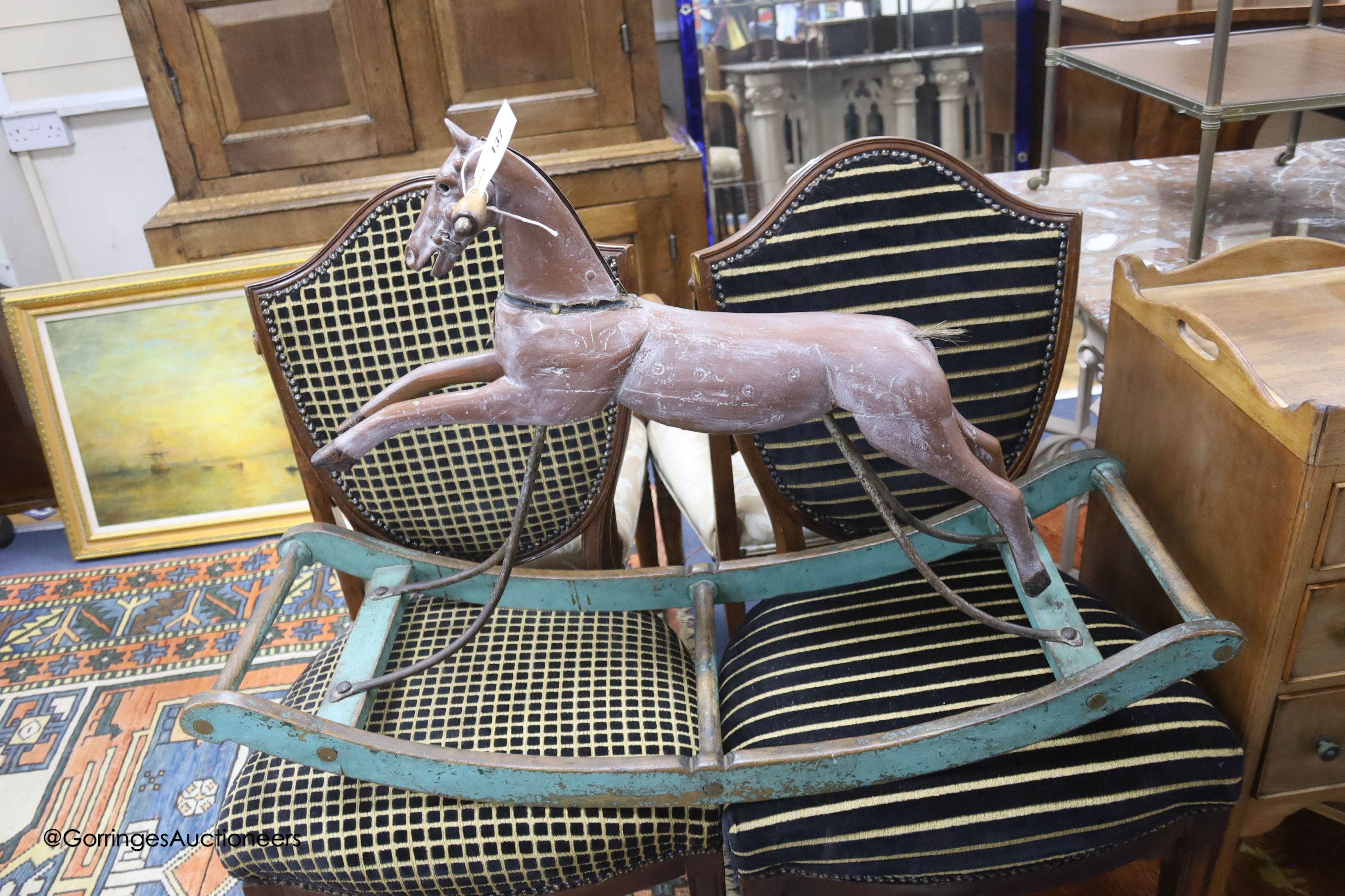 A Victorian rocking horse, on painted wood bow rocker stand